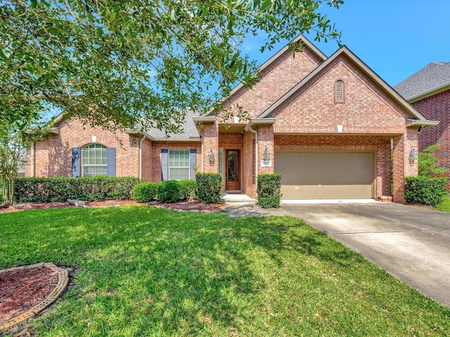 view of front of house featuring concrete driveway, brick siding, a front yard, and an attached garage