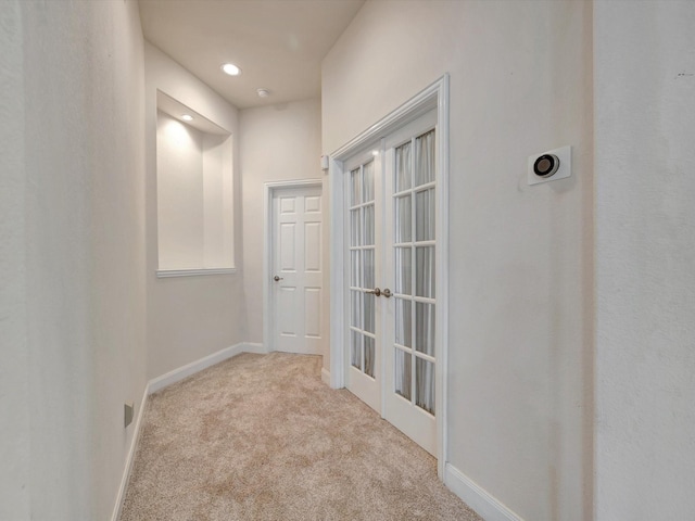 corridor featuring carpet, baseboards, and recessed lighting