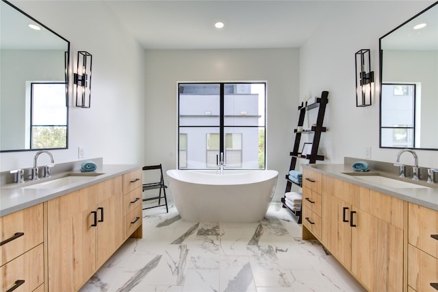 1611 W 22nd St Unit C, Houston, TX 77008 - full bath featuring healthy amount of natural light, two vanities, a freestanding tub, and recessed lighting