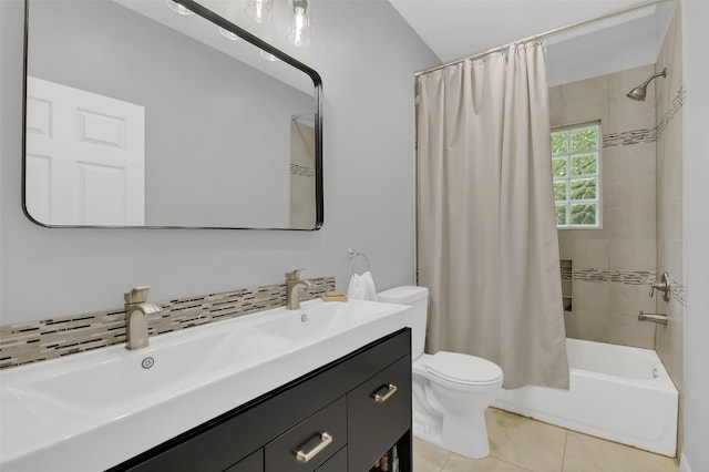 bathroom featuring toilet, shower / tub combo with curtain, tile patterned flooring, and double vanity
