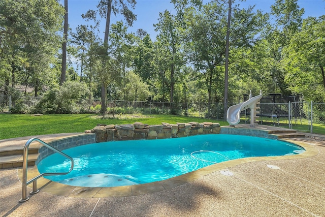 view of pool with a water slide