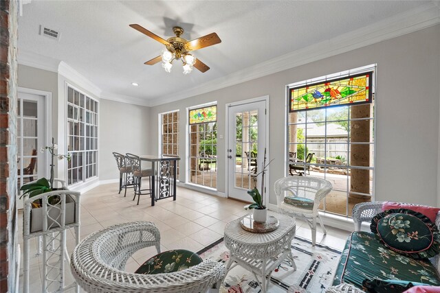 19827 Timberwind Ln, Houston, TX 77094 - living area with crown molding, ceiling fan, light tile patterned floors, baseboards, and french doors