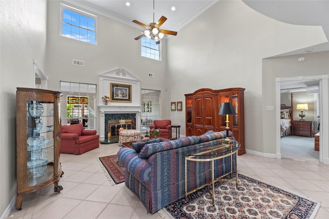 19827 Timberwind Ln, Houston, TX 77094 - living room featuring ceiling fan, light tile patterned floors, crown molding, baseboards, and a high ceiling