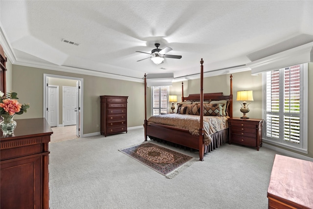 19827 Timberwind Ln, Houston, TX 77094 - bedroom with light colored carpet, ornamental molding, a textured ceiling, ceiling fan, and baseboards