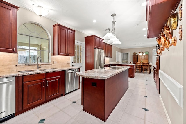 19827 Timberwind Ln, Houston, TX 77094 - kitchen with stainless steel appliances, a sink, reddish brown cabinets, decorative backsplash, and a kitchen island