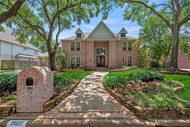 19827 Timberwind Ln, Houston, TX 77094 - colonial-style house featuring brick siding and french doors