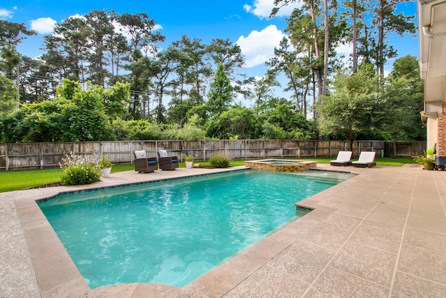 514 Chirping Sparrow Ct, Pinehurst, TX 77362 - view of pool with a patio, a fenced backyard, and a pool with connected hot tub