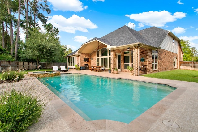 514 Chirping Sparrow Ct, Pinehurst, TX 77362 - view of pool with a ceiling fan, a patio, and a pool with connected hot tub