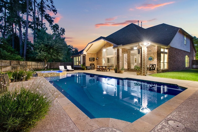 514 Chirping Sparrow Ct, Pinehurst, TX 77362 - view of pool with a fenced backyard, a patio, and a pool with connected hot tub