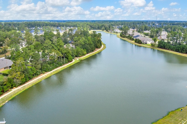 514 Chirping Sparrow Ct, Pinehurst, TX 77362 - aerial view of a nearby body of water and a tree filled landscape