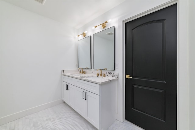 317 Kelley St, Houston, TX 77009 - bathroom with double vanity and baseboards