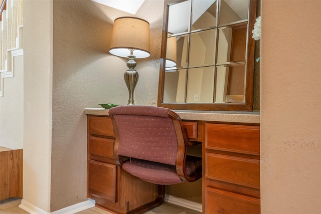 21623 Balsam Brook Ln, Katy, TX 77450 - office area featuring a textured wall, baseboards, and built in desk