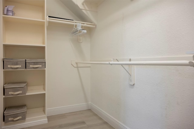 21623 Balsam Brook Ln, Katy, TX 77450 - walk in closet featuring wood finished floors