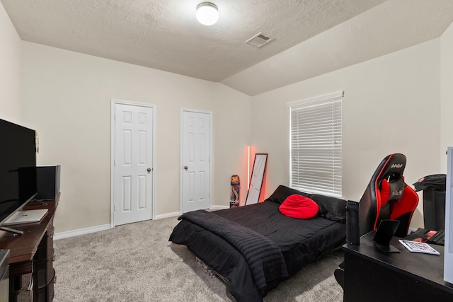 30722 Lavender Trace Dr, Spring, TX 77386 - bedroom featuring an office area, carpet, lofted ceiling, baseboards, and a textured ceiling