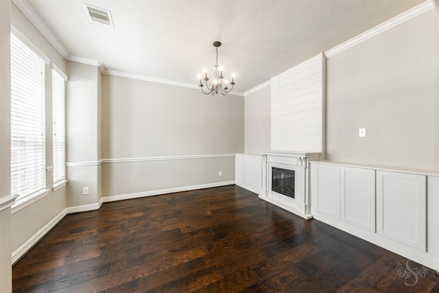 3722 Rocky Ledge Ln, Katy, TX 77494 - unfurnished living room featuring a chandelier, crown molding, plenty of natural light, dark wood-type flooring, and a glass covered fireplace