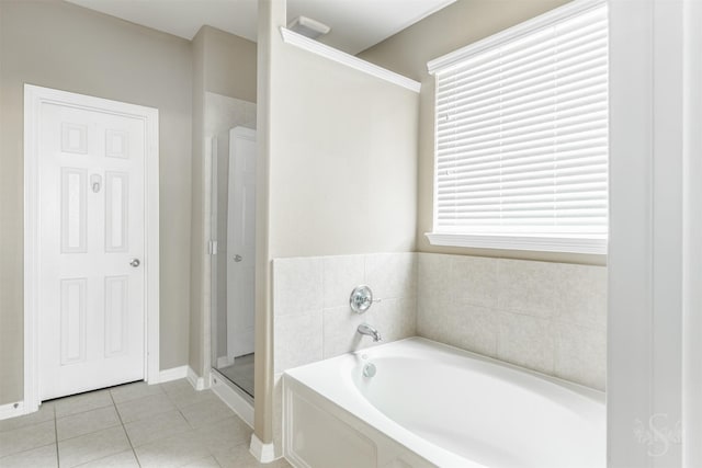 3722 Rocky Ledge Ln, Katy, TX 77494 - full bath featuring a bath, tile patterned flooring, a stall shower, and baseboards