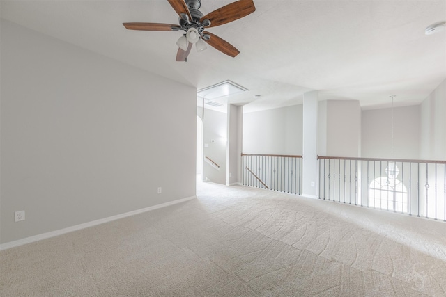 3722 Rocky Ledge Ln, Katy, TX 77494 - spare room featuring carpet, ceiling fan, attic access, and baseboards
