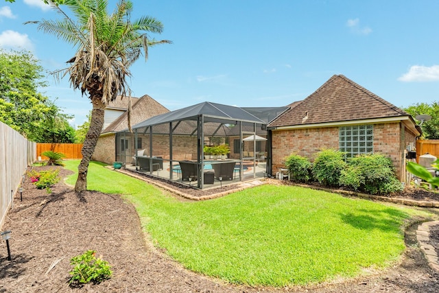 54 Scotch Pine Ct, Lake Jackson, TX 77566 - rear view of property featuring a patio area, a lanai, an outdoor pool, roof with shingles, and brick siding