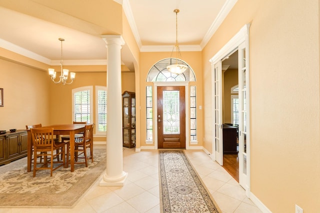 54 Scotch Pine Ct, Lake Jackson, TX 77566 - entryway featuring light tile patterned flooring, ornamental molding, baseboards, and a chandelier