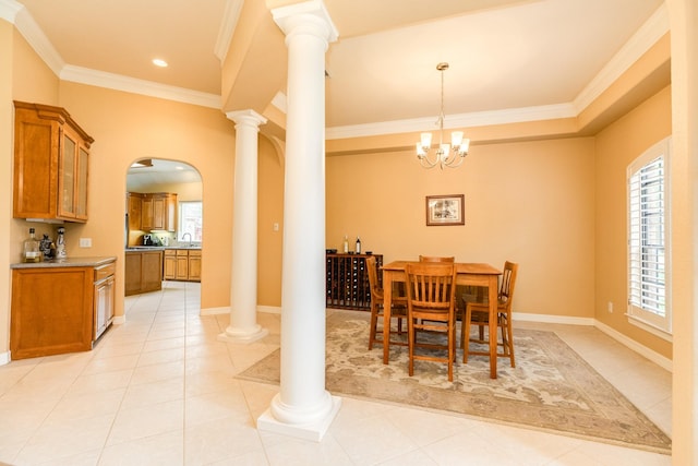 54 Scotch Pine Ct, Lake Jackson, TX 77566 - dining room featuring ornamental molding, arched walkways, light tile patterned floors, ornate columns, and a chandelier