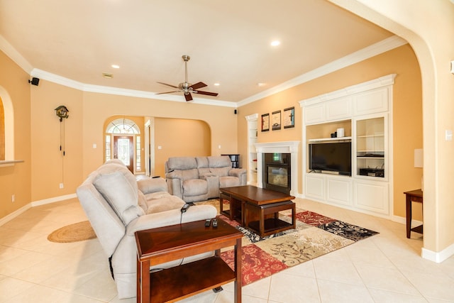 54 Scotch Pine Ct, Lake Jackson, TX 77566 - living room with arched walkways, light tile patterned floors, ceiling fan, ornamental molding, and baseboards