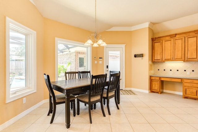 54 Scotch Pine Ct, Lake Jackson, TX 77566 - dining area with healthy amount of natural light, a chandelier, light tile patterned flooring, and baseboards