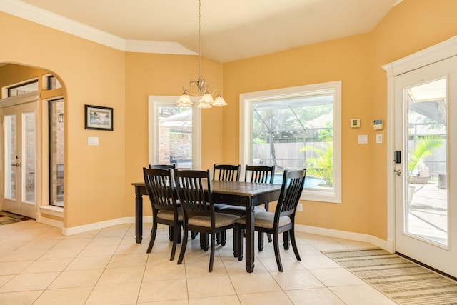 54 Scotch Pine Ct, Lake Jackson, TX 77566 - dining room with arched walkways, a chandelier, light tile patterned floors, baseboards, and ornamental molding