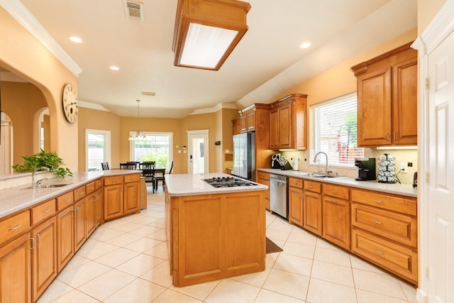 54 Scotch Pine Ct, Lake Jackson, TX 77566 - kitchen with stainless steel appliances, a sink, a center island, recessed lighting, and crown molding