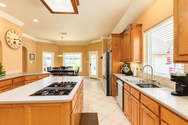 54 Scotch Pine Ct, Lake Jackson, TX 77566 - kitchen with appliances with stainless steel finishes, a sink, light countertops, light tile patterned flooring, and ornamental molding