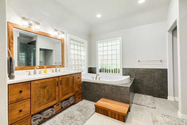 54 Scotch Pine Ct, Lake Jackson, TX 77566 - bathroom with a bath, tiled shower, double vanity, tile patterned floors, and recessed lighting
