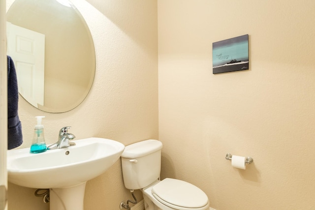 54 Scotch Pine Ct, Lake Jackson, TX 77566 - bathroom featuring toilet and a sink