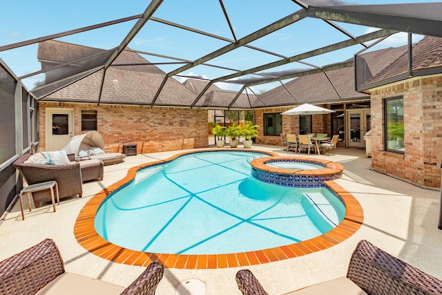 54 Scotch Pine Ct, Lake Jackson, TX 77566 - view of swimming pool with a patio area, a pool with connected hot tub, an outdoor hangout area, and glass enclosure