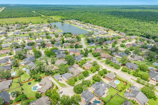 54 Scotch Pine Ct, Lake Jackson, TX 77566 - aerial view of residential area with a heavily wooded area and a large body of water