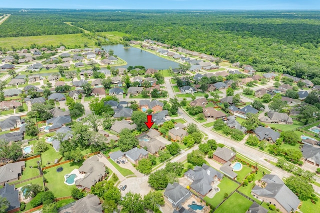 54 Scotch Pine Ct, Lake Jackson, TX 77566 - aerial view of residential area featuring a forest and a large body of water