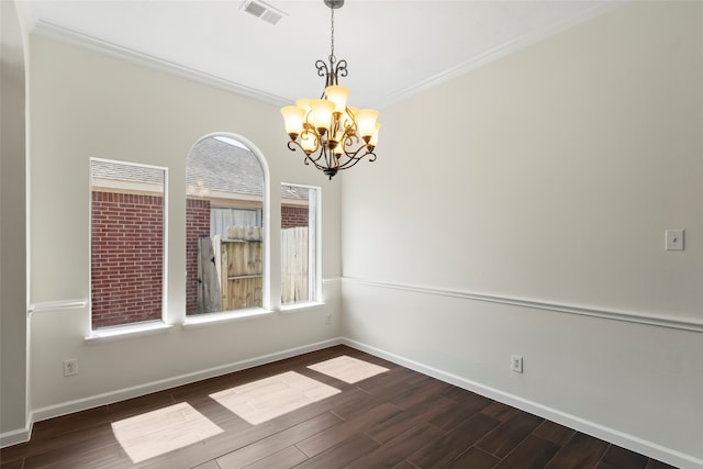 unfurnished dining area with a chandelier, dark wood finished floors, baseboards, and ornamental molding
