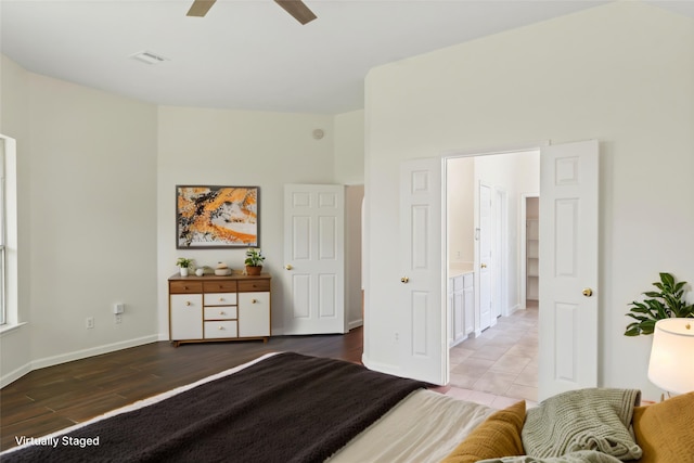 bedroom featuring wood finished floors, baseboards, and ceiling fan