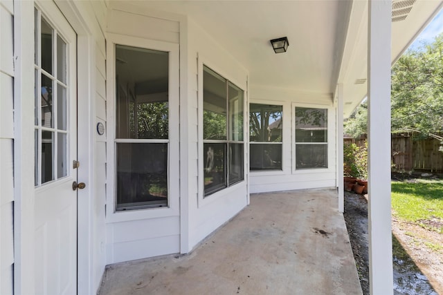 view of patio / terrace featuring fence