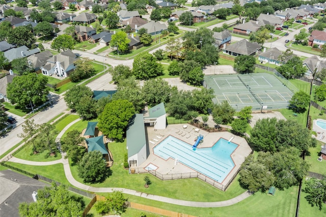 aerial perspective of suburban area featuring a pool area