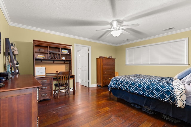bedroom featuring dark wood-style floors, ornamental molding, a textured ceiling, a desk, and ceiling fan