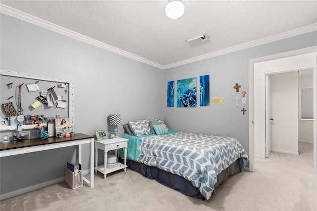 carpeted bedroom with ornamental molding, baseboards, and a textured ceiling