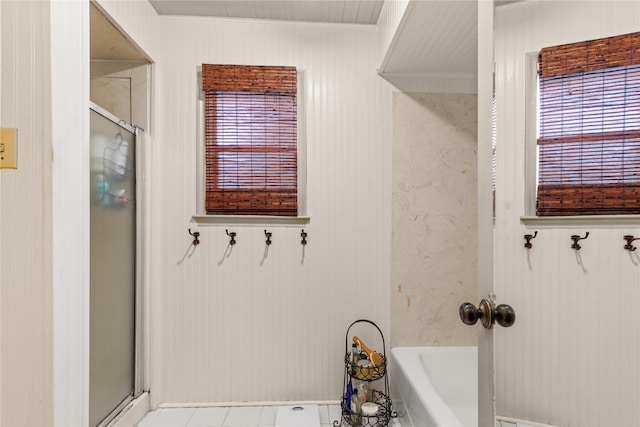 full bath featuring an enclosed shower and a tub to relax in