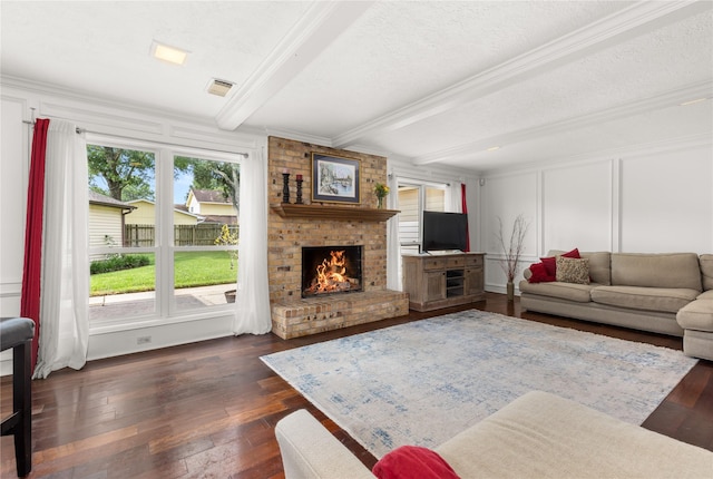 15922 Clearcrest Dr, Houston, TX 77059 - living area with beamed ceiling, plenty of natural light, a brick fireplace, dark wood-type flooring, and a decorative wall