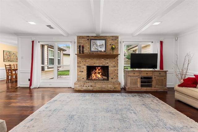 15922 Clearcrest Dr, Houston, TX 77059 - living area with wood finished floors, beamed ceiling, ornamental molding, and a brick fireplace