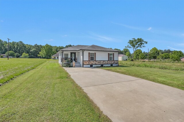 1107 Cypress St, Diboll, TX 75941 - view of front of property with a porch, a front yard, and concrete driveway