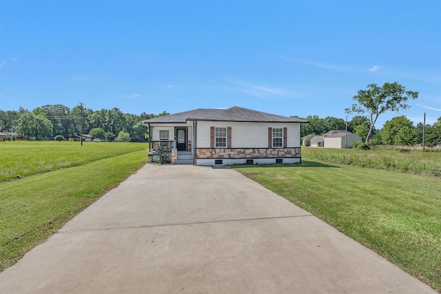 1107 Cypress St, Diboll, TX 75941 - view of front of property with a porch, a front lawn, and concrete driveway
