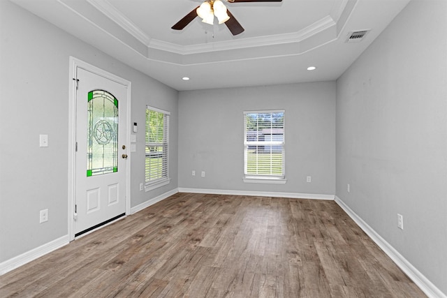 1107 Cypress St, Diboll, TX 75941 - entryway with a raised ceiling, wood finished floors, ceiling fan, crown molding, and baseboards
