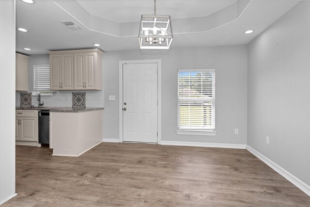 1107 Cypress St, Diboll, TX 75941 - kitchen featuring dishwashing machine, recessed lighting, light wood-type flooring, tasteful backsplash, and a sink