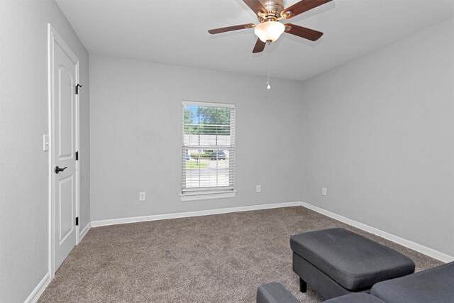 1107 Cypress St, Diboll, TX 75941 - living area featuring carpet flooring, ceiling fan, and baseboards
