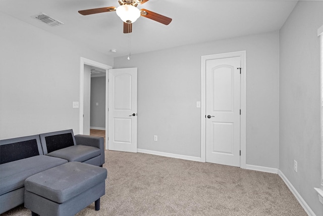 1107 Cypress St, Diboll, TX 75941 - sitting room featuring a ceiling fan, carpet, and baseboards