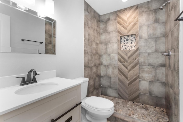 1107 Cypress St, Diboll, TX 75941 - bathroom with tiled shower, vanity, and toilet